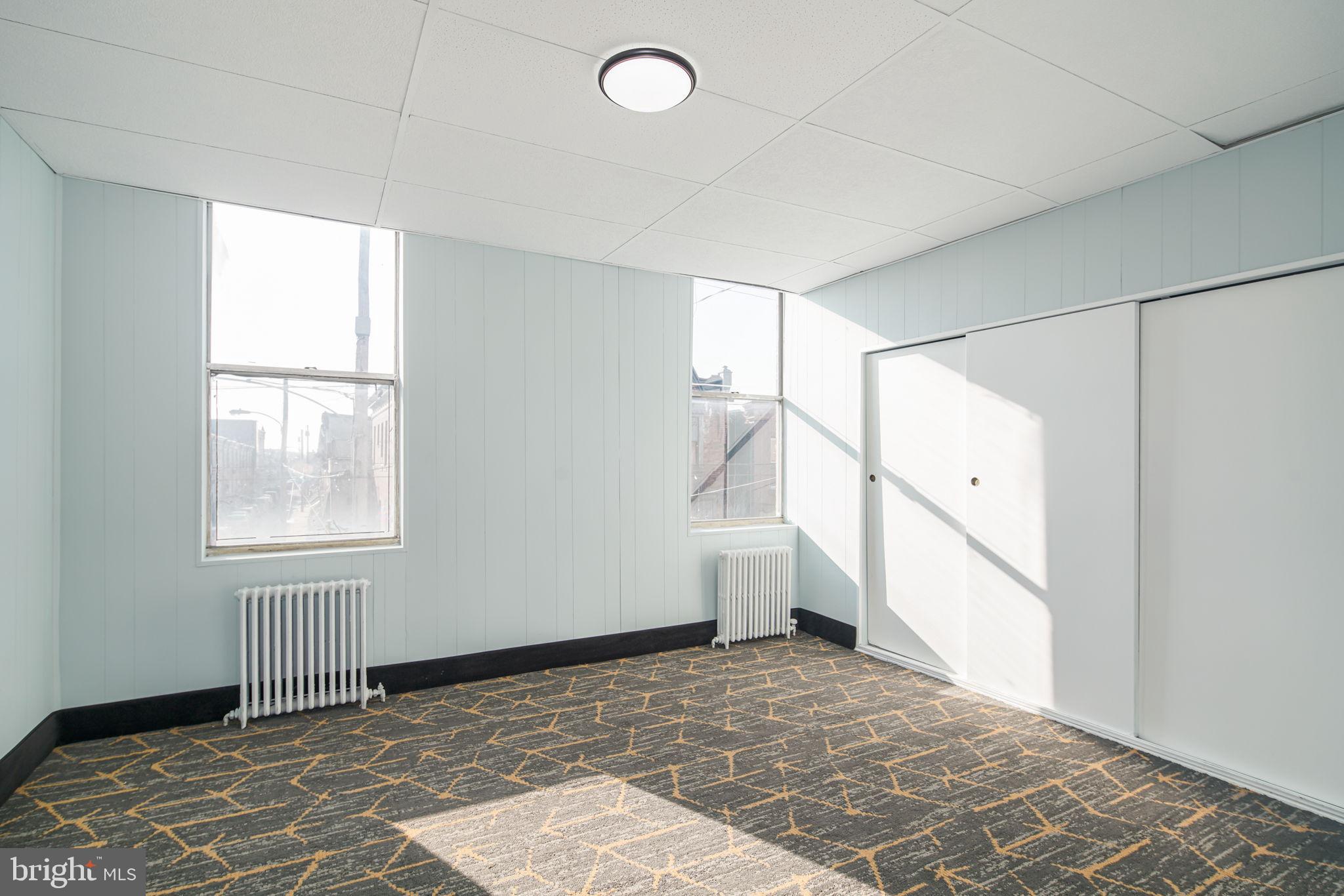 1735 Mifflin Street Philadelphia, PA 19145 - Photo 11 of 16 a view of an empty room with a window