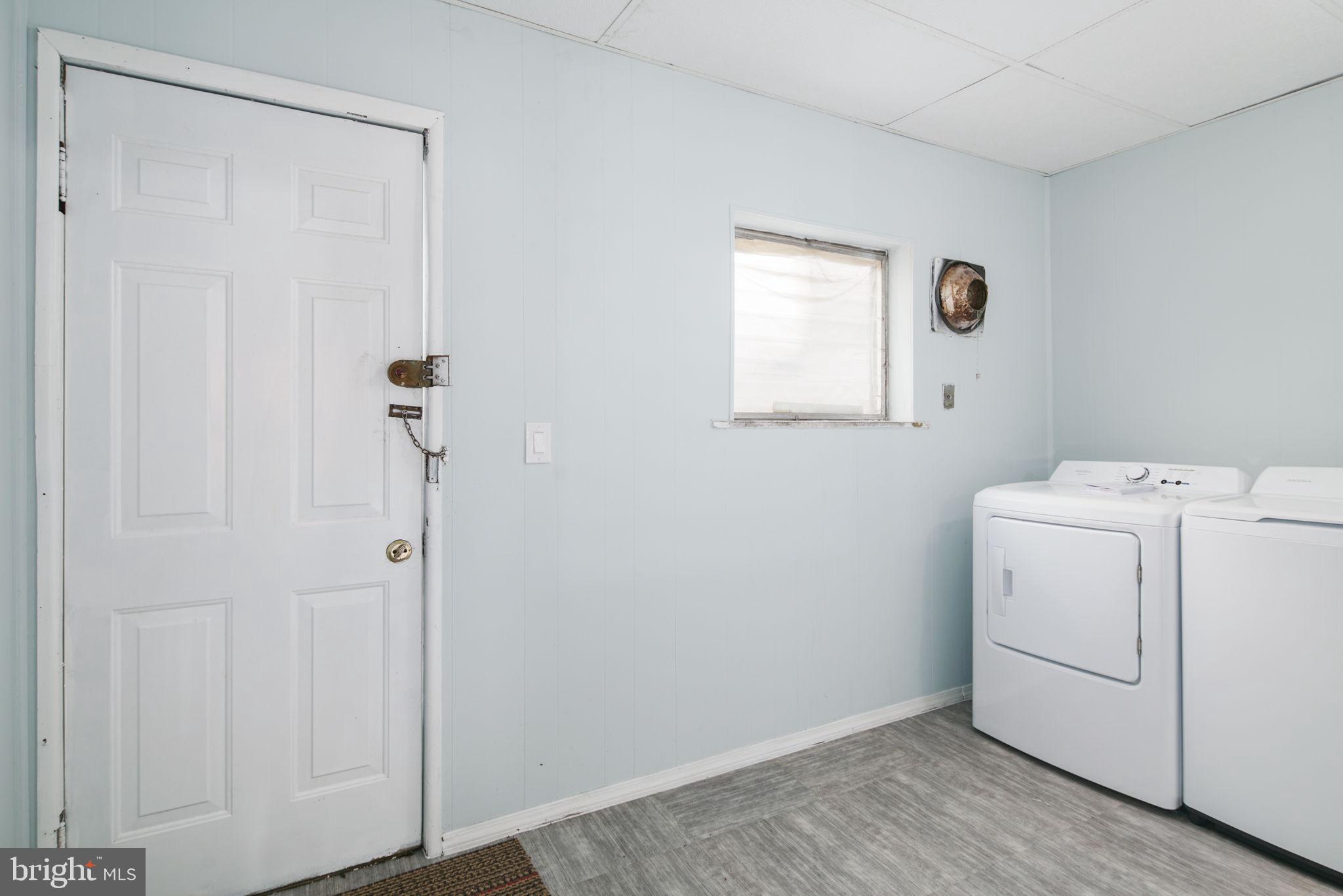 1735 Mifflin Street Philadelphia, PA 19145 - Photo 7 of 16 a view of a room with dryer and washer