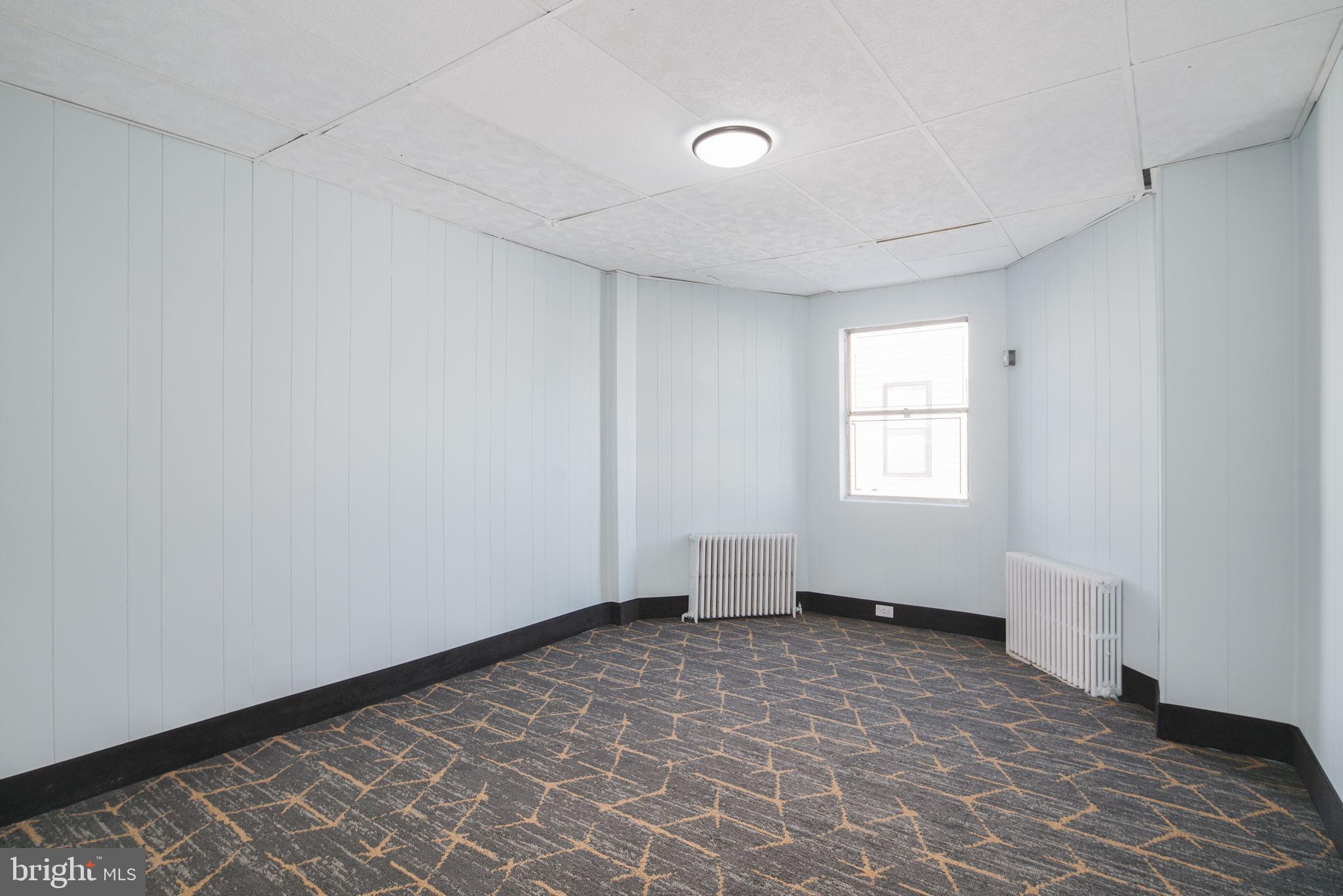 1735 Mifflin Street Philadelphia, PA 19145 - Photo 8 of 16 a view of an empty room with a window