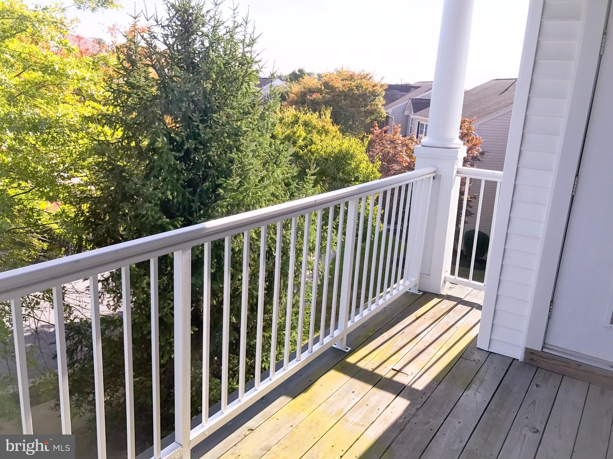 41 Hawk Rise Lane, Unit 202 Owings Mills, MD 21117 - Photo 13 of 33 a view of a balcony with wooden floor