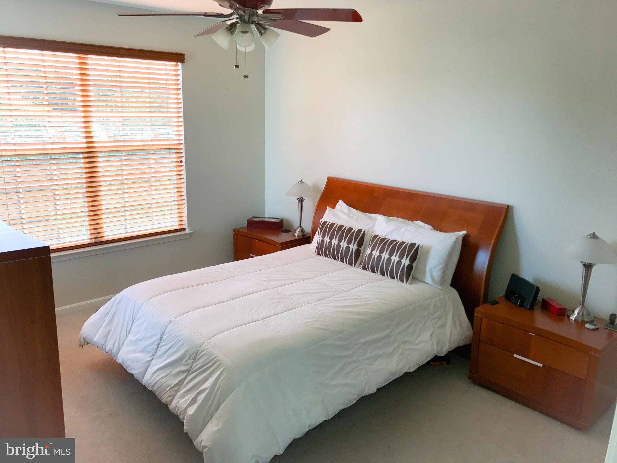 41 Hawk Rise Lane, Unit 202 Owings Mills, MD 21117 - Photo 19 of 33 a bedroom with a bed and a window