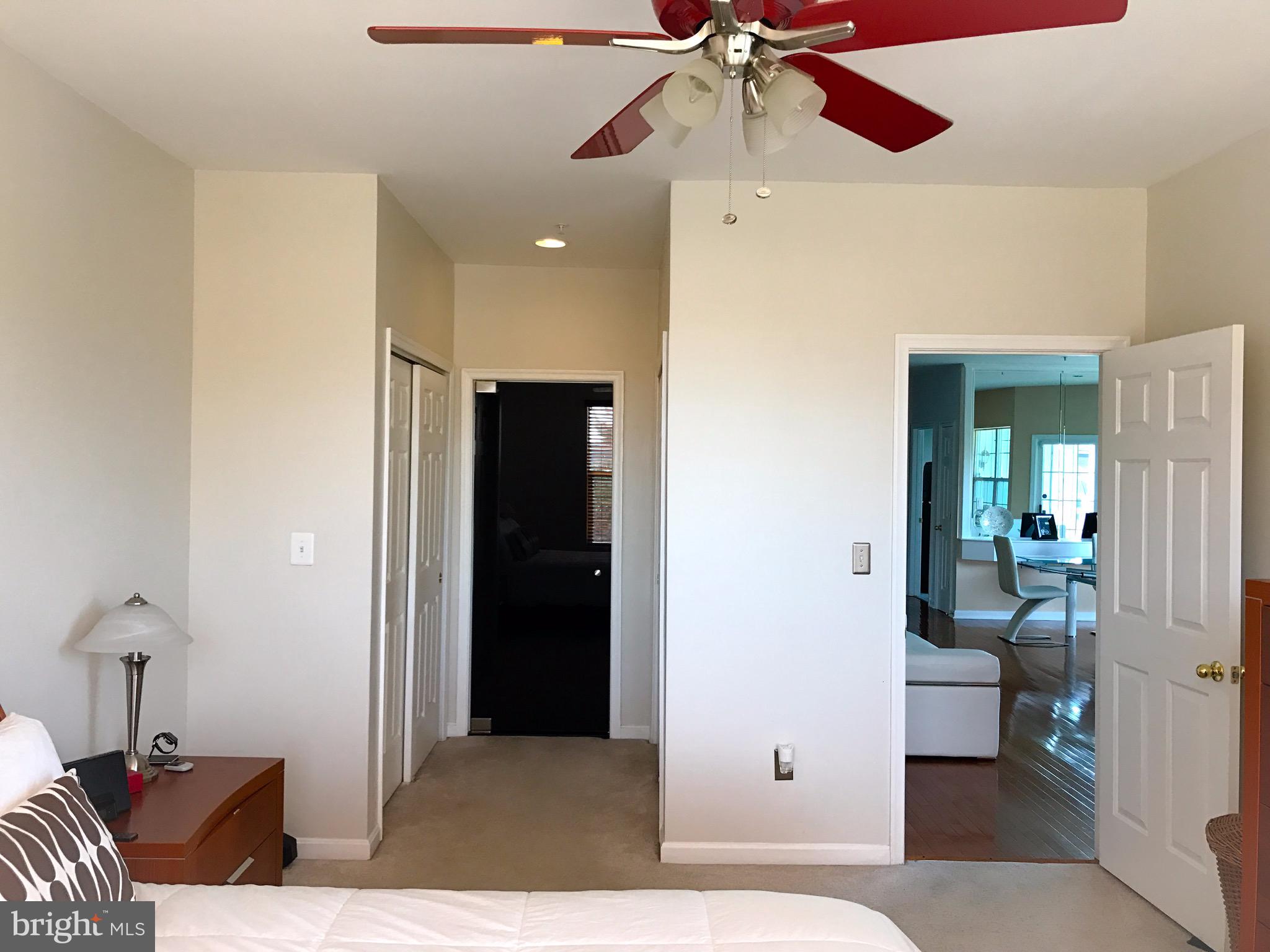 41 Hawk Rise Lane, Unit 202 Owings Mills, MD 21117 - Photo 21 of 33 a bedroom with a bed and a chandelier fan