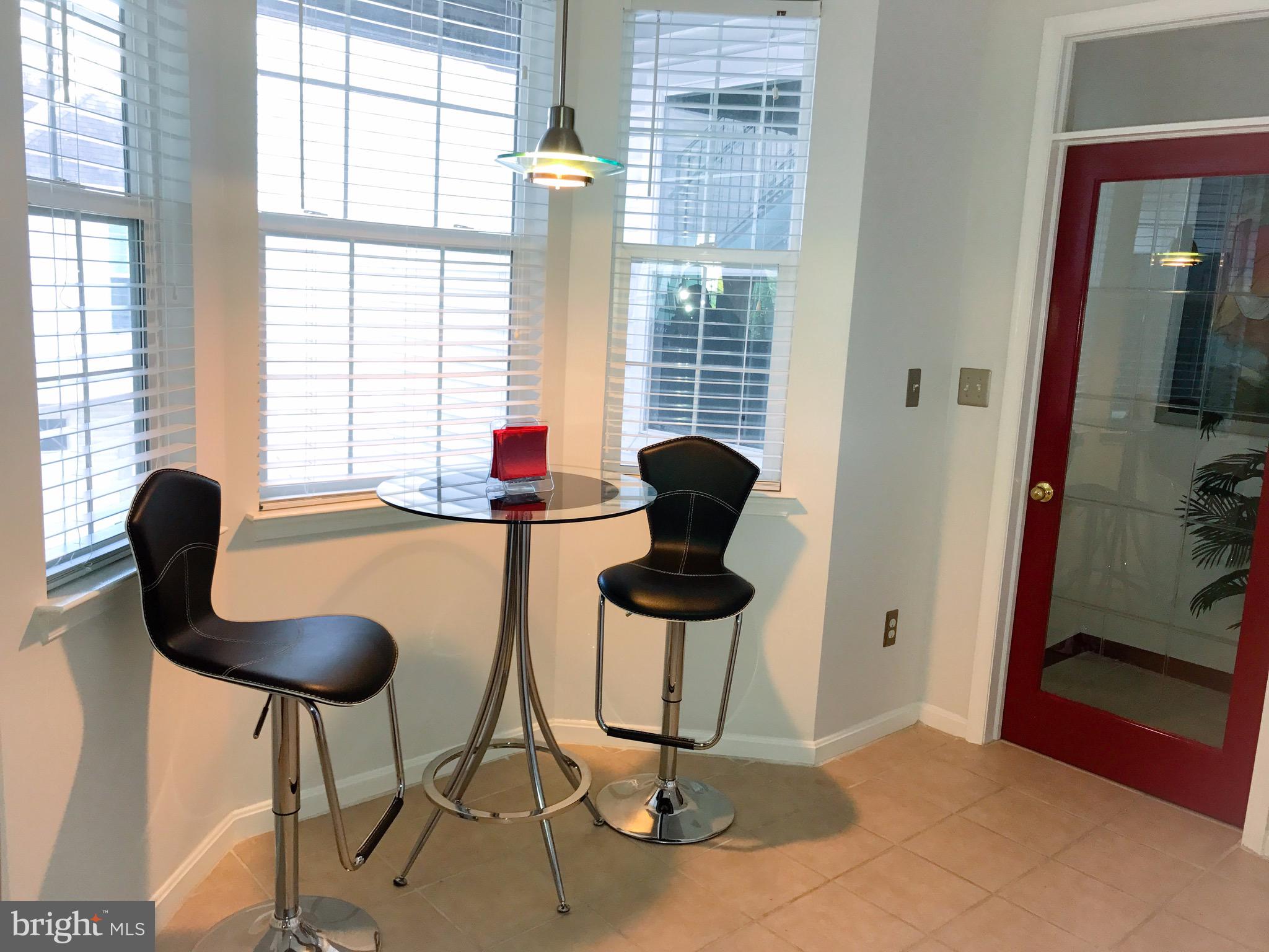 41 Hawk Rise Lane, Unit 202 Owings Mills, MD 21117 - Photo 6 of 33 a view of a livingroom with furniture and a window