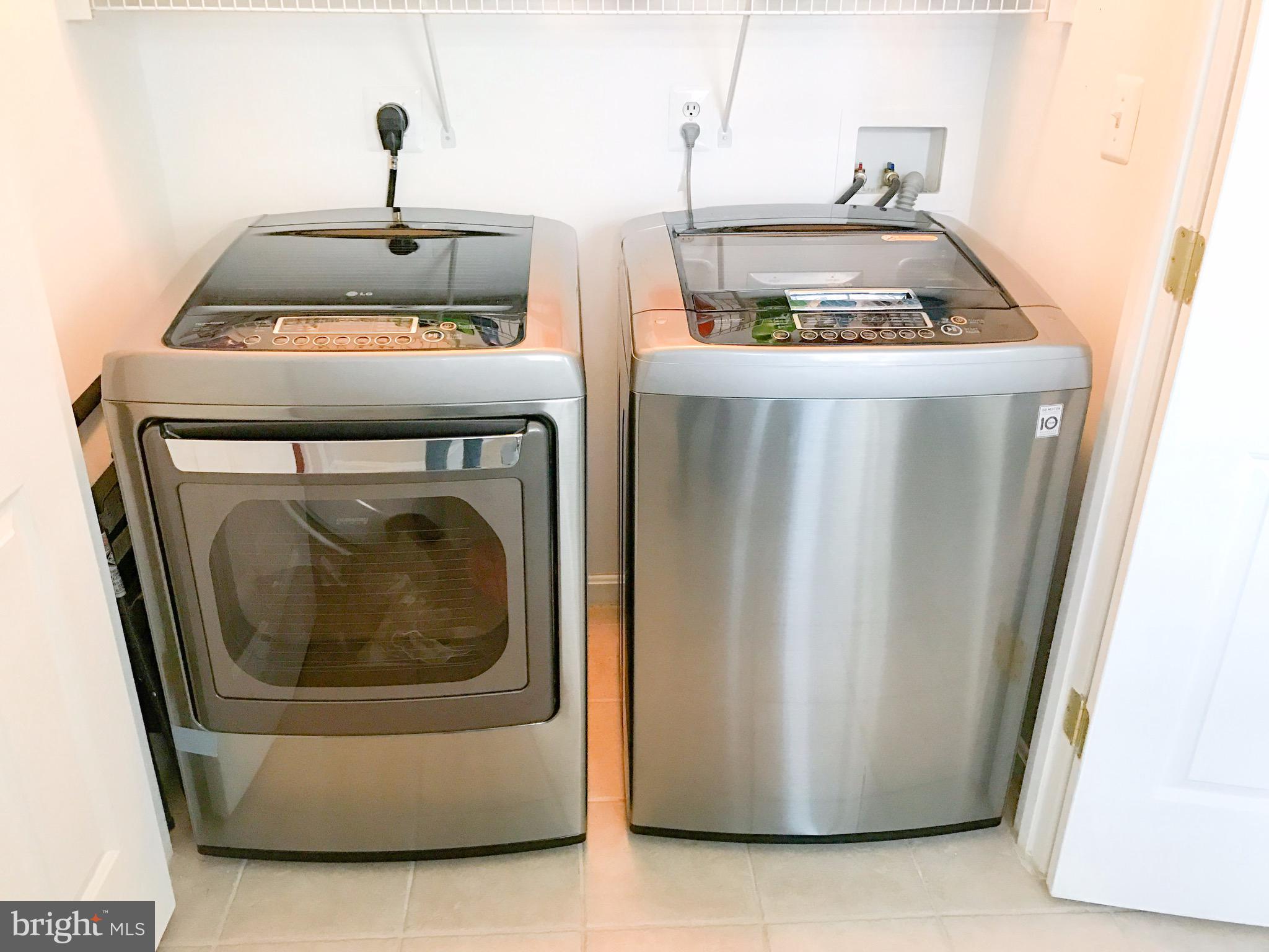 41 Hawk Rise Lane, Unit 202 Owings Mills, MD 21117 - Photo 7 of 33 a utility room with dryer and washer