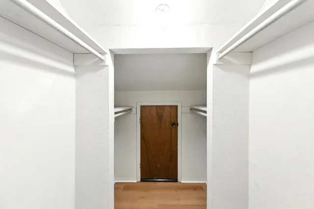 a bathroom with a sink vanity mirror and toilet