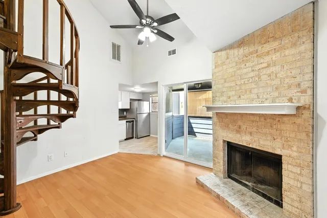 a kitchen that has a sink stainless steel appliances and cabinets