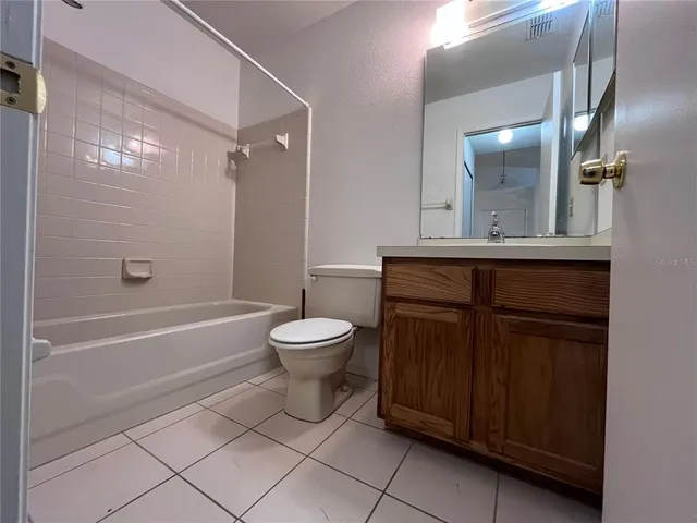 a bathroom with a toilet a sink and bathtub