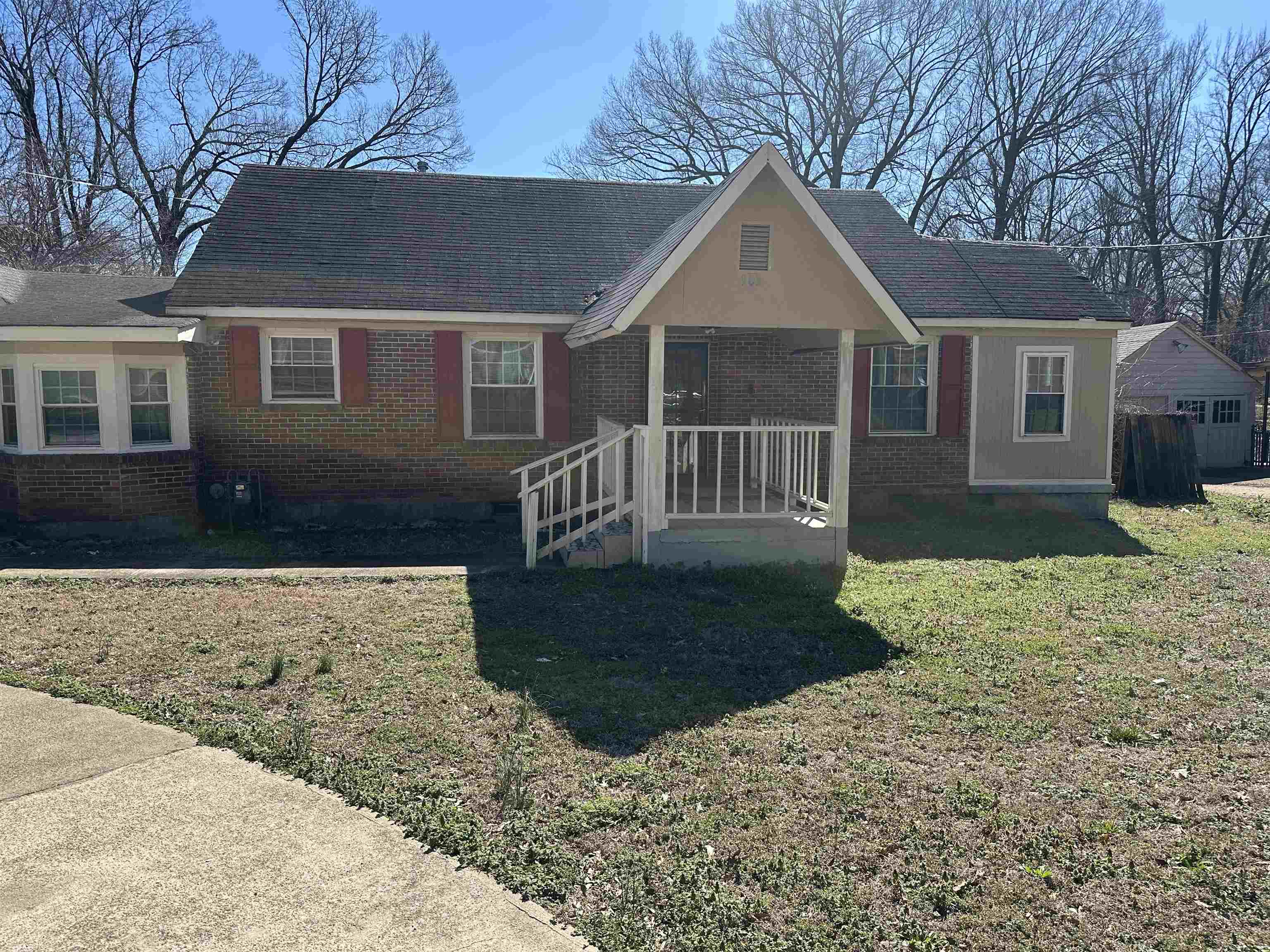 903 Mosby Road Memphis, TN 38116 - Photo 1 of 9 a front view of a house with a yard and garage