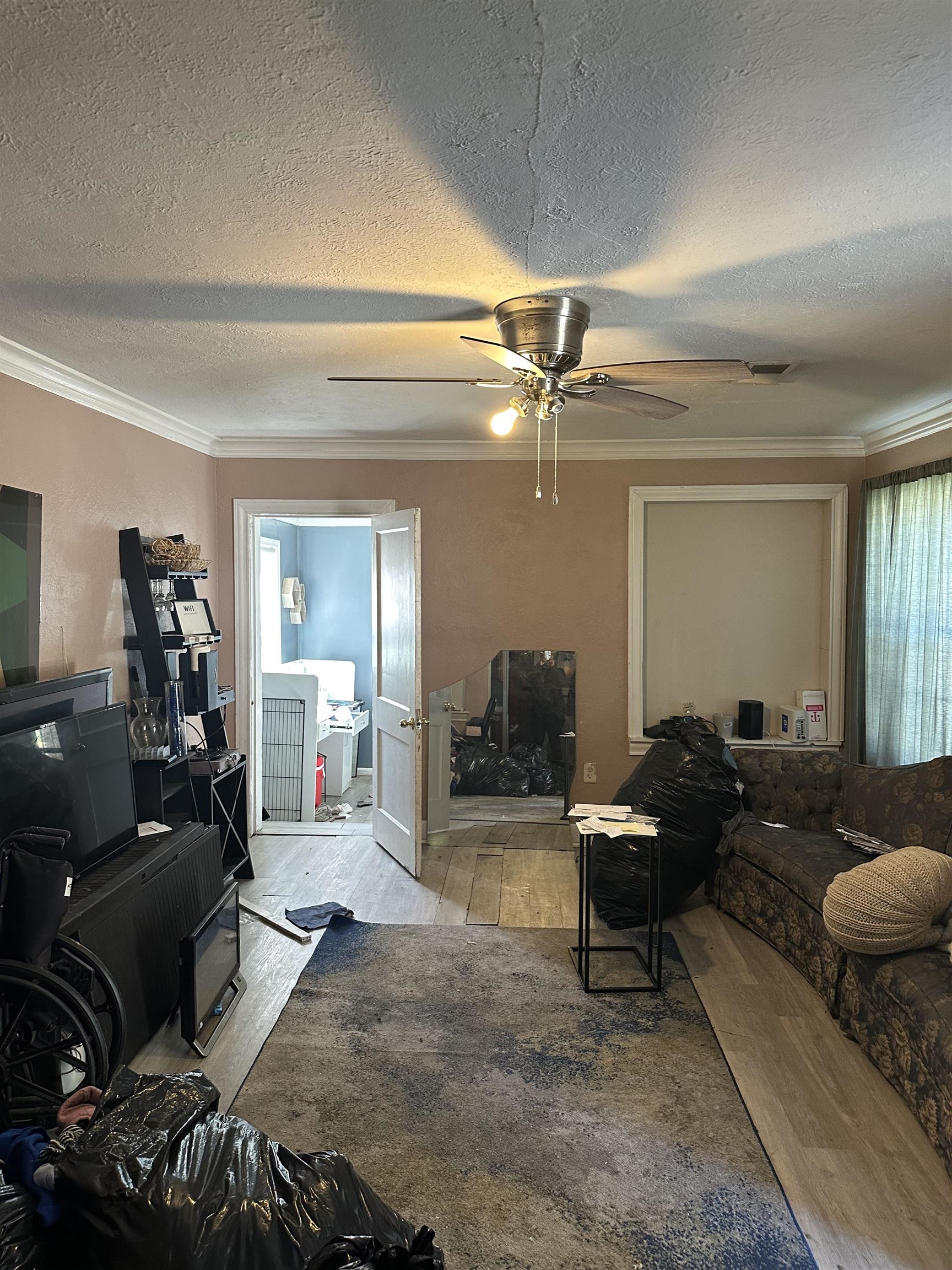 903 Mosby Road Memphis, TN 38116 - Photo 2 of 9 a living room with furniture and a chandelier