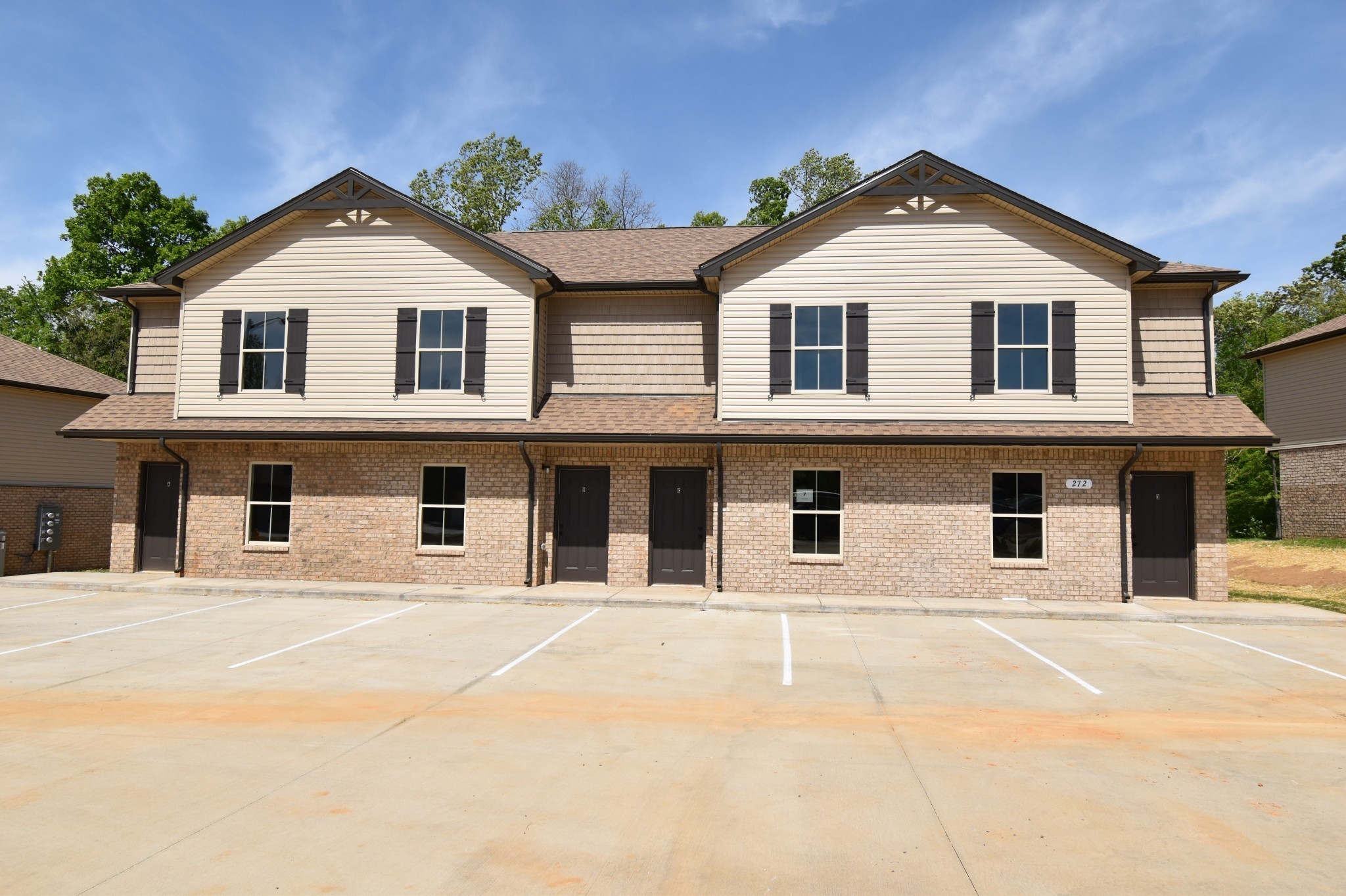 255 Smithson Lane, Unit B Clarksville, TN 37040 - Photo 1 of 21 a view of white house with large windows