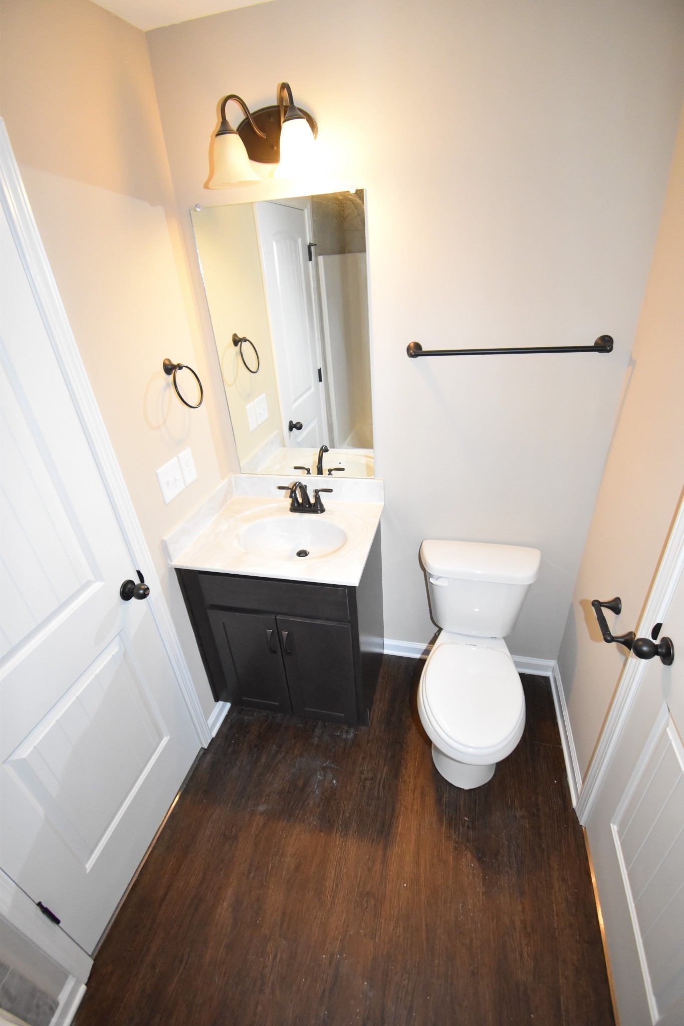 255 Smithson Lane, Unit B Clarksville, TN 37040 - Photo 18 of 21 a bathroom with a sink toilet and mirror