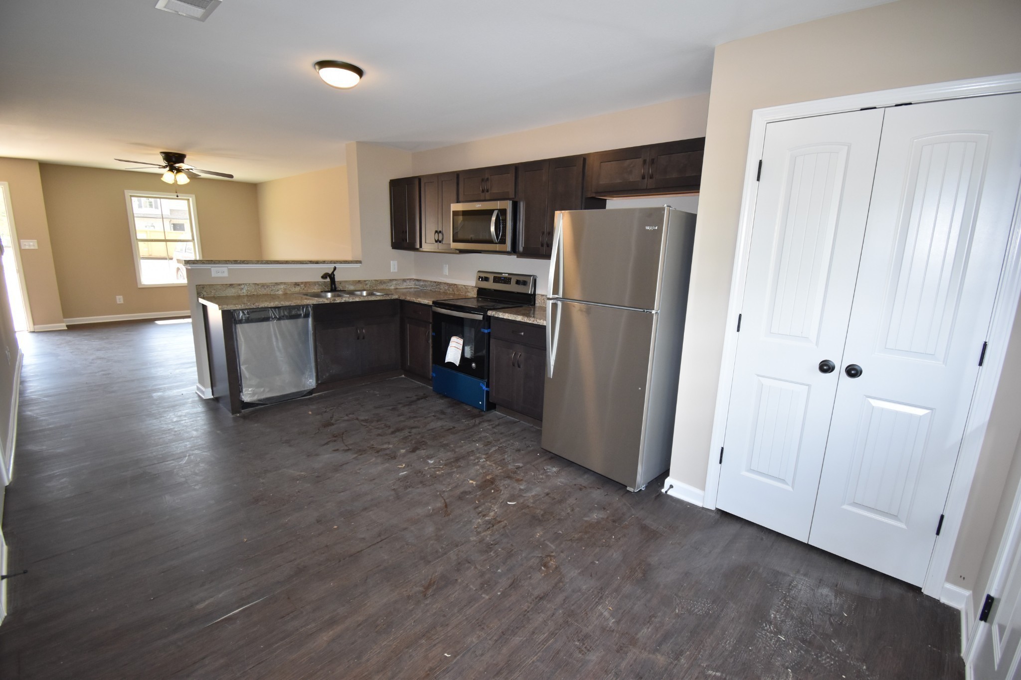 255 Smithson Lane, Unit B Clarksville, TN 37040 - Photo 5 of 21 a kitchen with a refrigerator and a stove top oven