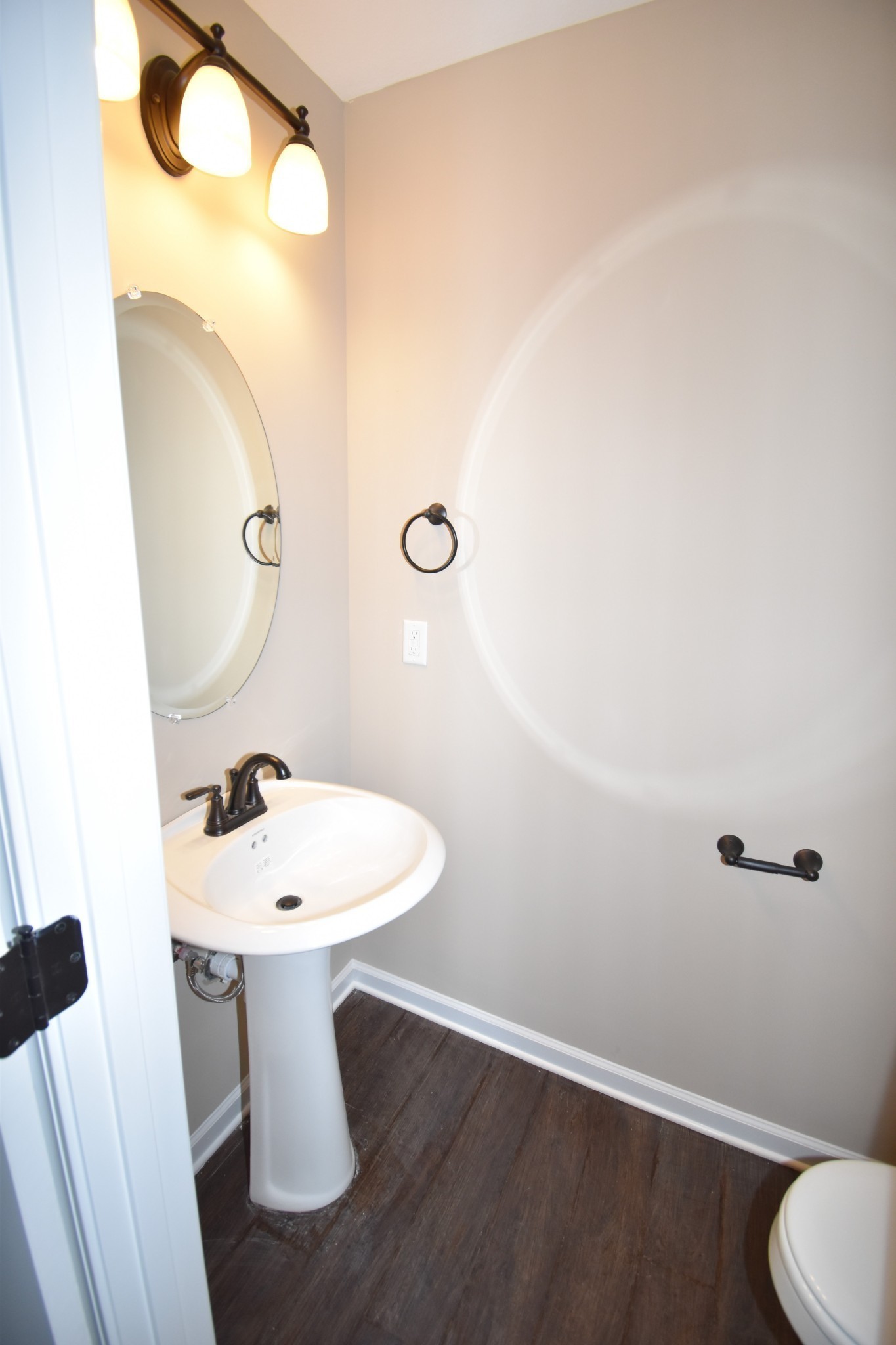 255 Smithson Lane, Unit B Clarksville, TN 37040 - Photo 8 of 21 a bathroom with a sink mirror and toilet
