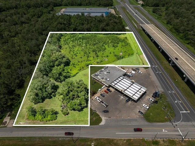 an aerial view of house with yard