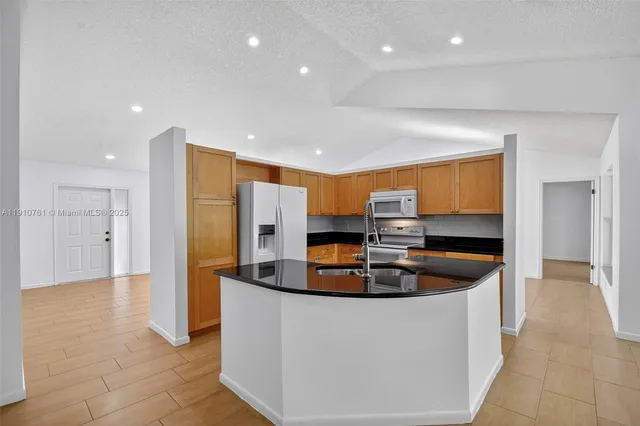 a view of a swimming pool with a lounge chairs