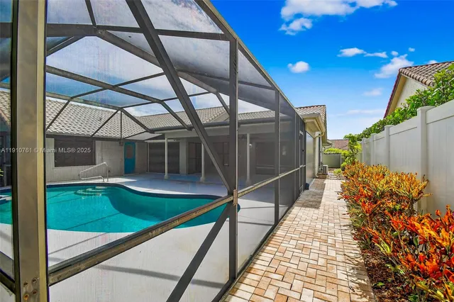 a view of room with window and wooden floor