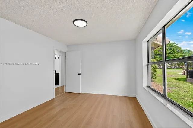 a view of a tall brick building with large windows