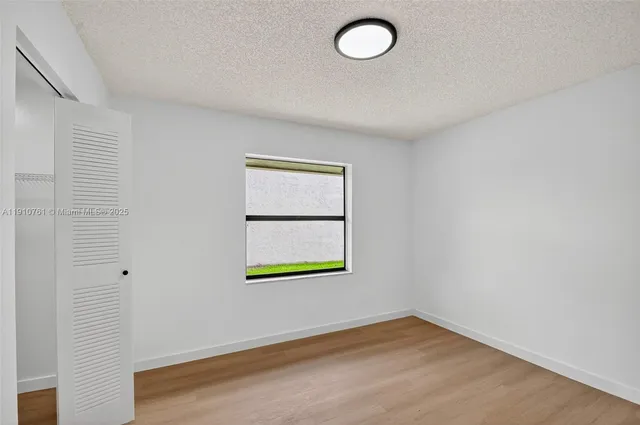 a view of a park with a tree