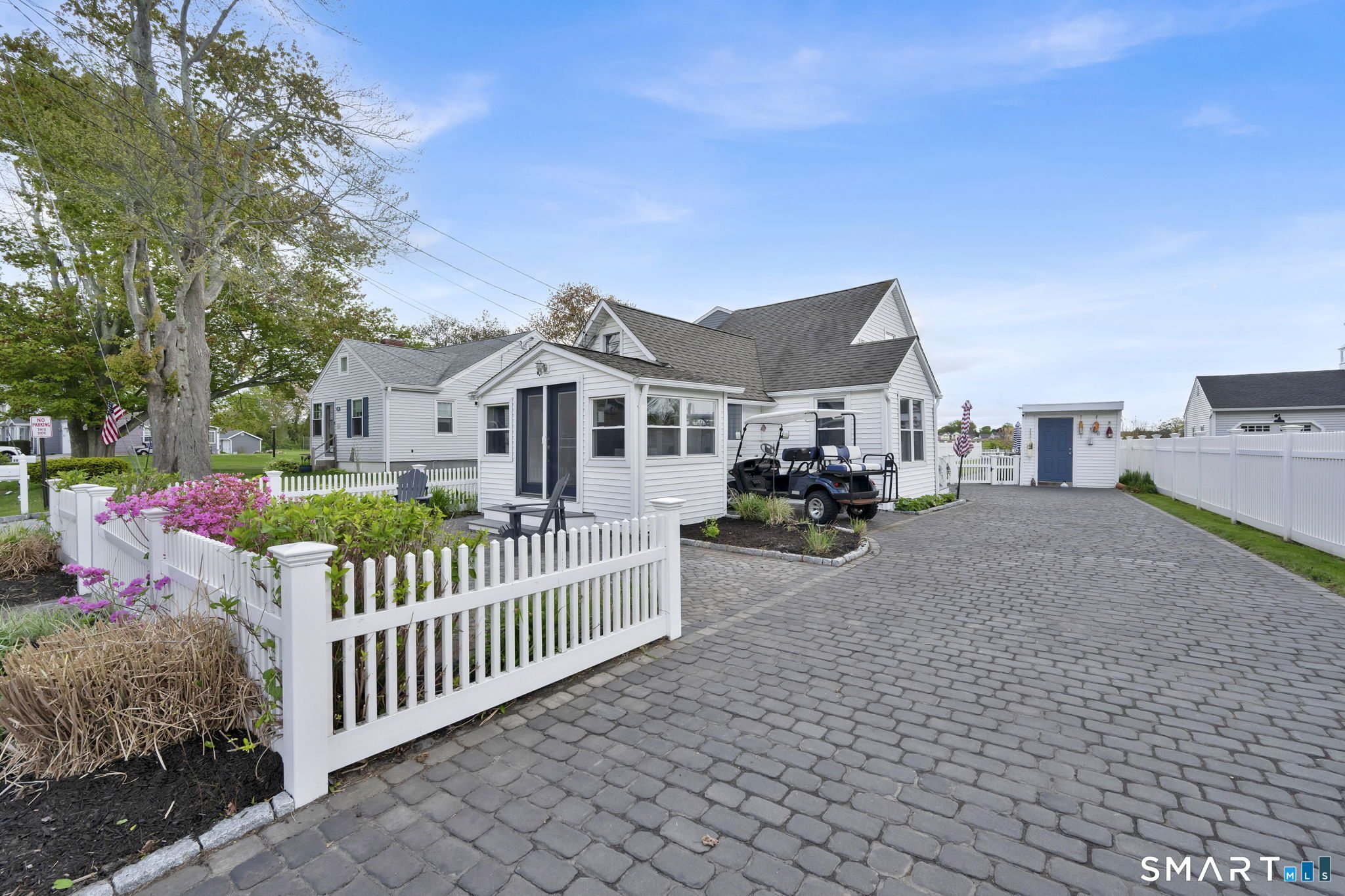 96 Chalker Beach Road Old Saybrook, CT 06475 - Photo 6 of 33 a front view of a house with garden