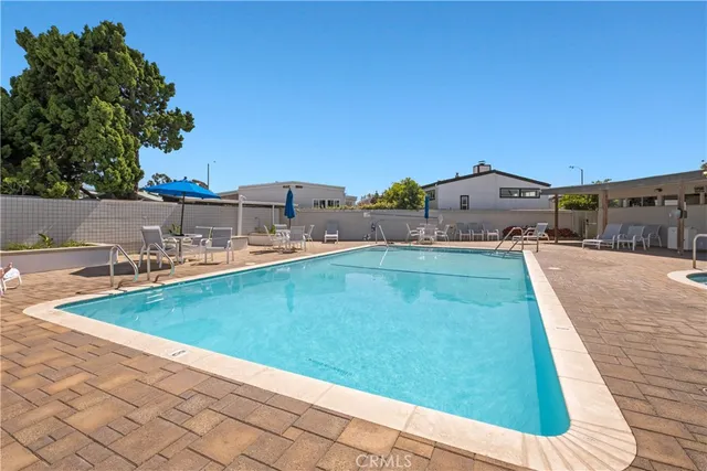 a view of a garden with a bench in a garden