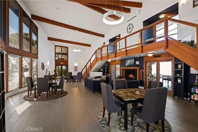 a view of a swimming pool with a table and chairs