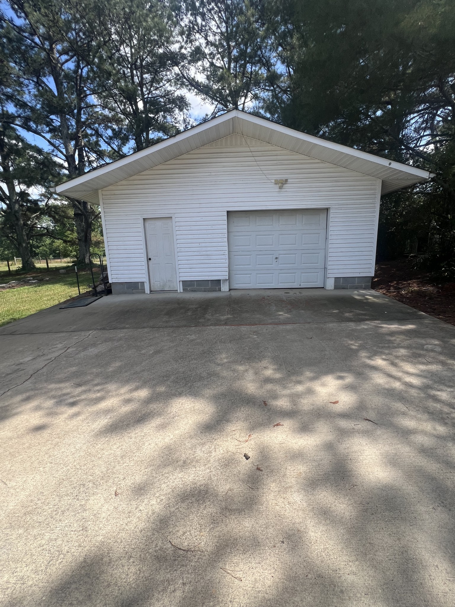 149 Hawthorne Street Pulaski, TN 38478 - Photo 30 of 33 a white house that has a tree in front of it