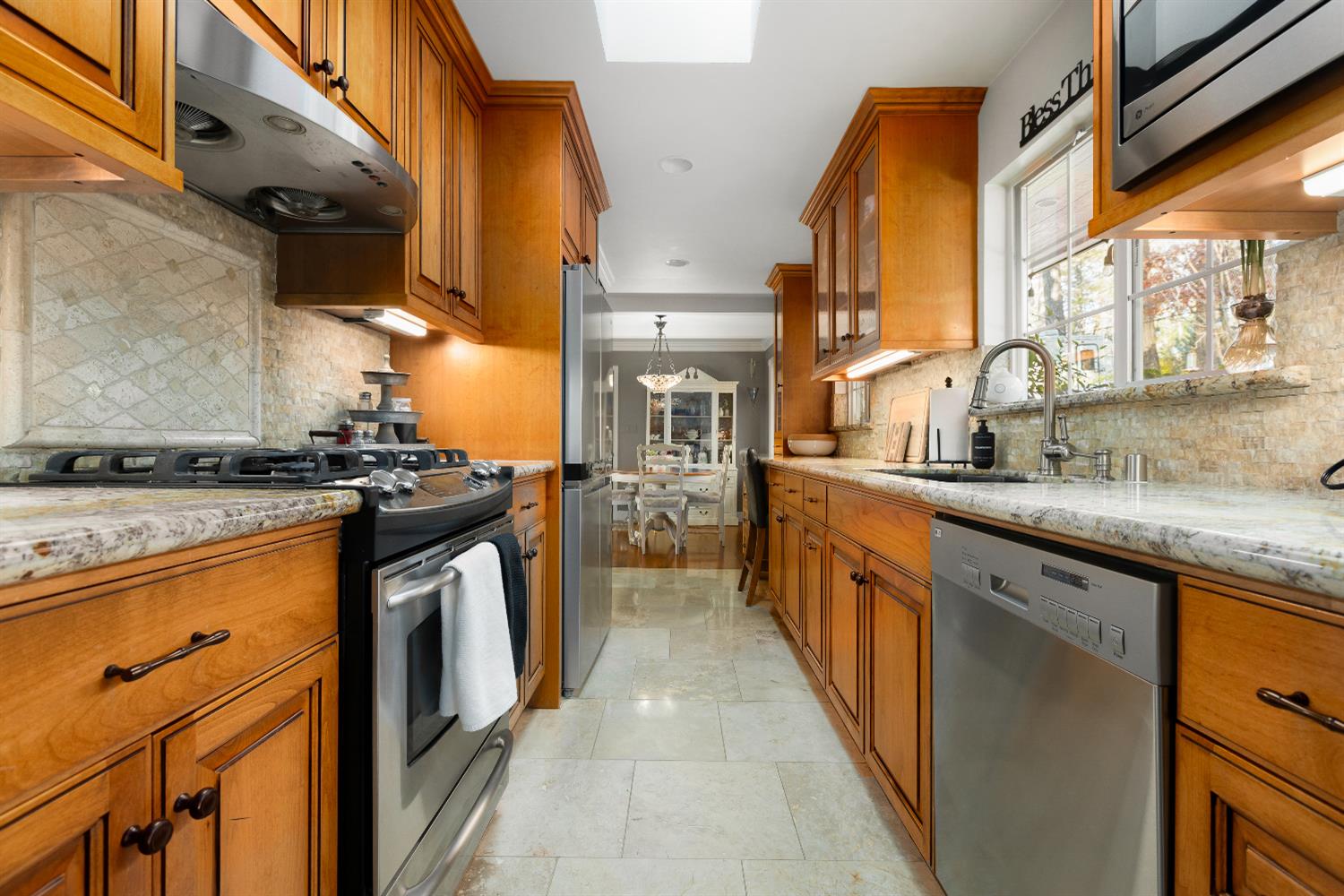 12636 Nottingham Lane Grass Valley, CA 95949 - Photo 3 of 34 a kitchen with stainless steel appliances granite countertop a stove and a sink