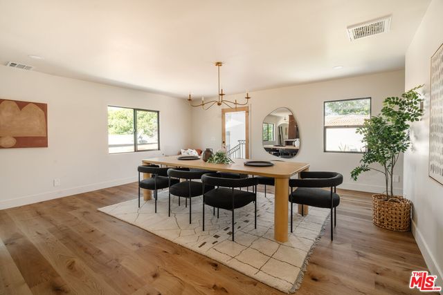 a view of a dining room with furniture and window