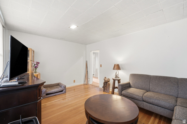 5264 West 5500th Street South Hooper, UT 84315 - Photo 6 of 38 Living area featuring wood-finish flooring, white walls, and a recessed ceiling light fixture