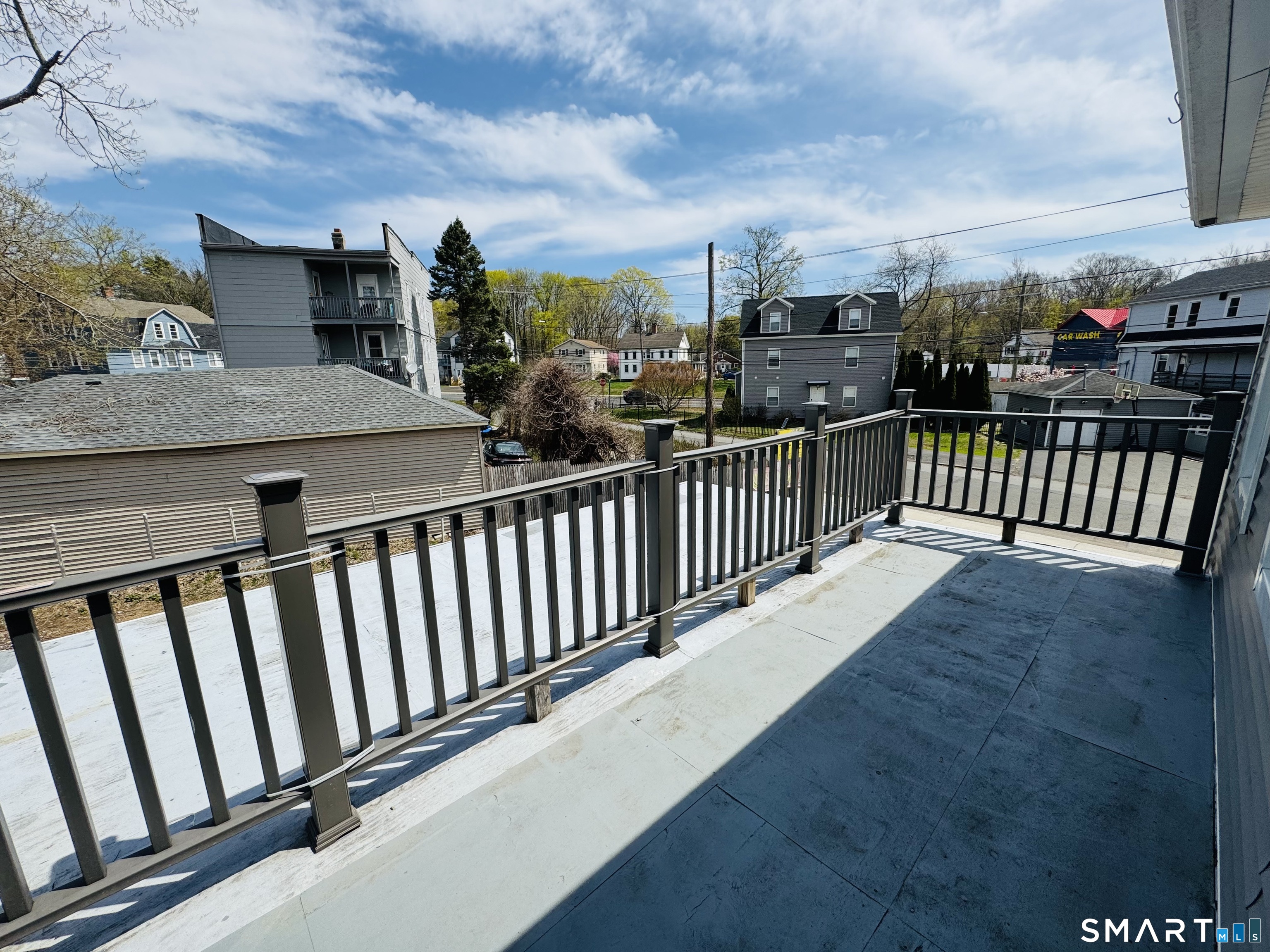 260 Bunker Avenue, Unit 2 Meriden, CT 06450 - Photo 8 of 9 a view of a balcony with an outdoor seating