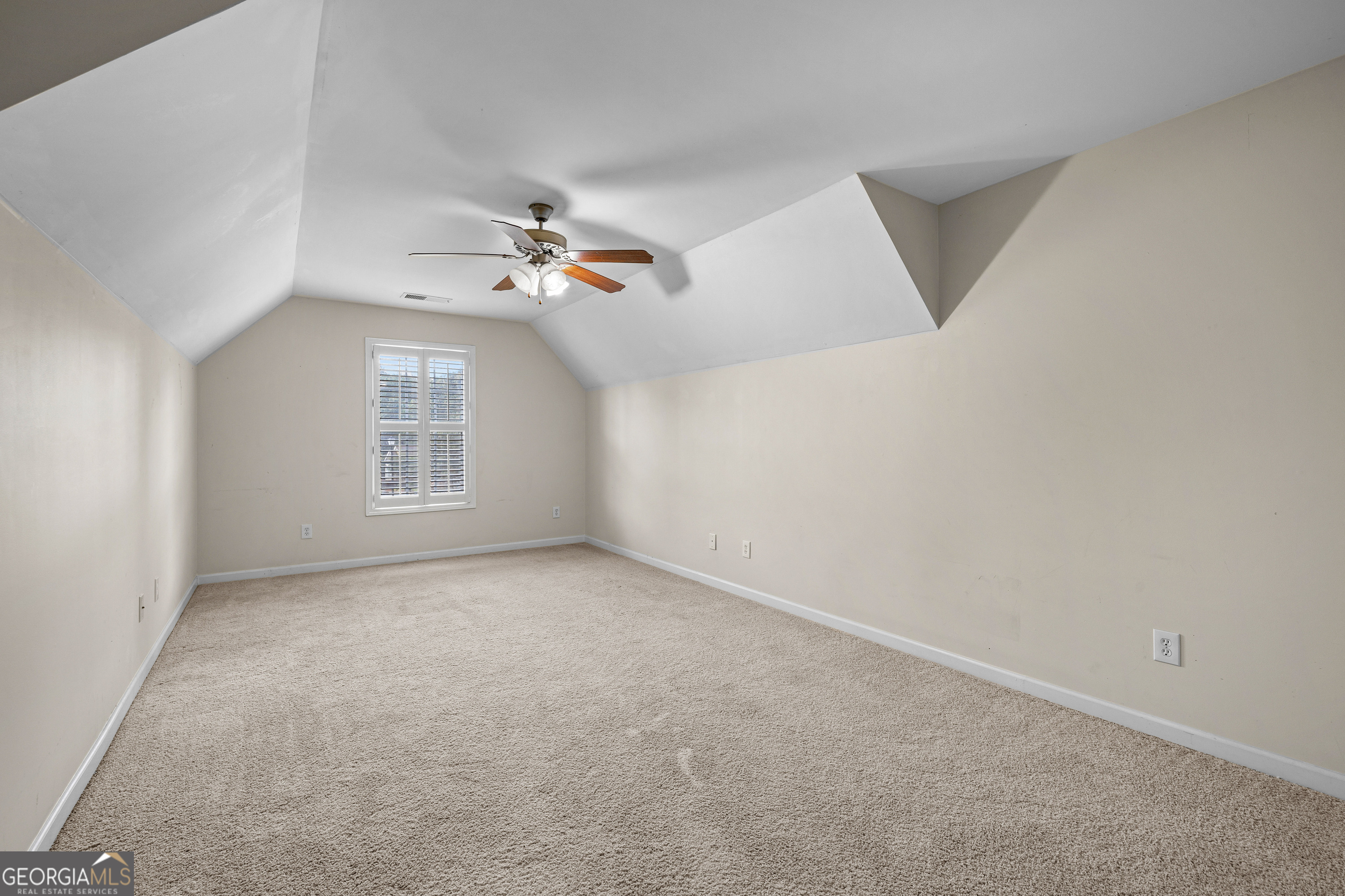 120 Shankhill Ridge Tyrone, GA 30290 - Photo 39 of 54 an empty room with windows and ceiling fan view