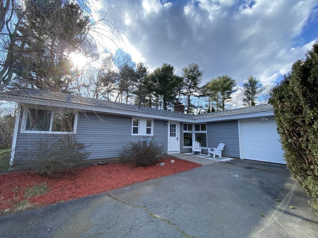 a front view of a house with yard