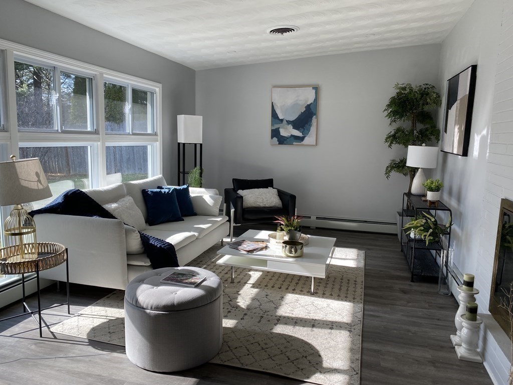 82 Griffin Road Framingham, MA 01701 - Photo 11 of 39 a living room with furniture and a potted plant