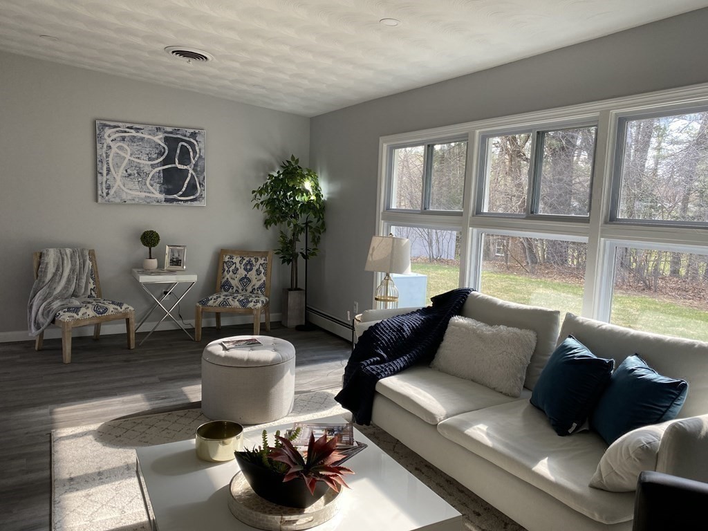82 Griffin Road Framingham, MA 01701 - Photo 14 of 39 a living room with furniture and a potted plant