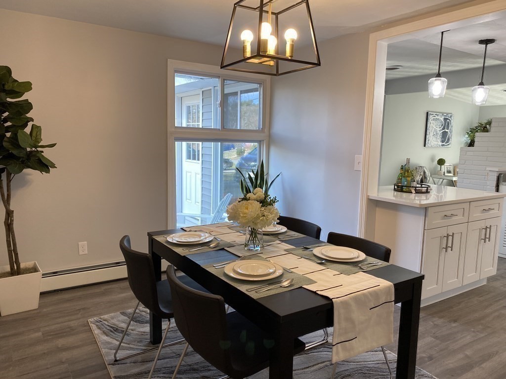 82 Griffin Road Framingham, MA 01701 - Photo 21 of 39 a view of a dining room with furniture and wooden floor