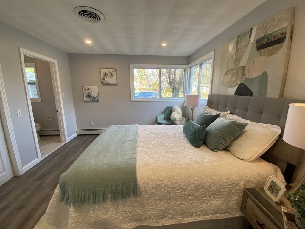 82 Griffin Road Framingham, MA 01701 - Photo 24 of 39 a large bedroom with a bed and wooden floor