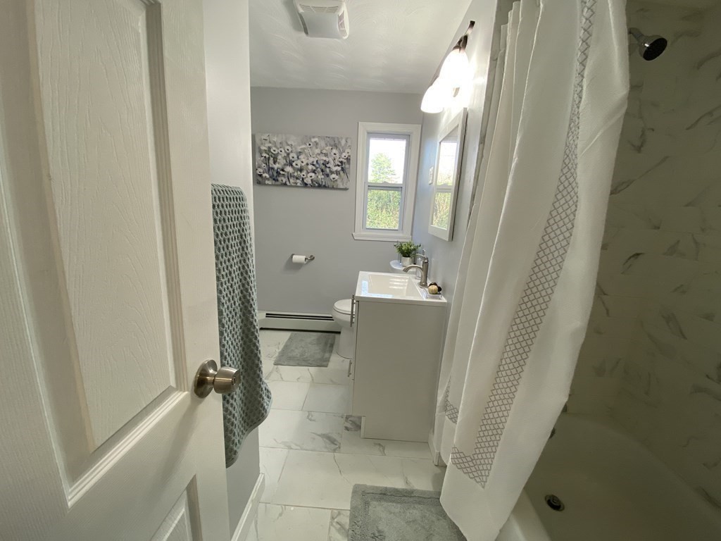82 Griffin Road Framingham, MA 01701 - Photo 27 of 39 a bathroom with a sink a toilet and shower