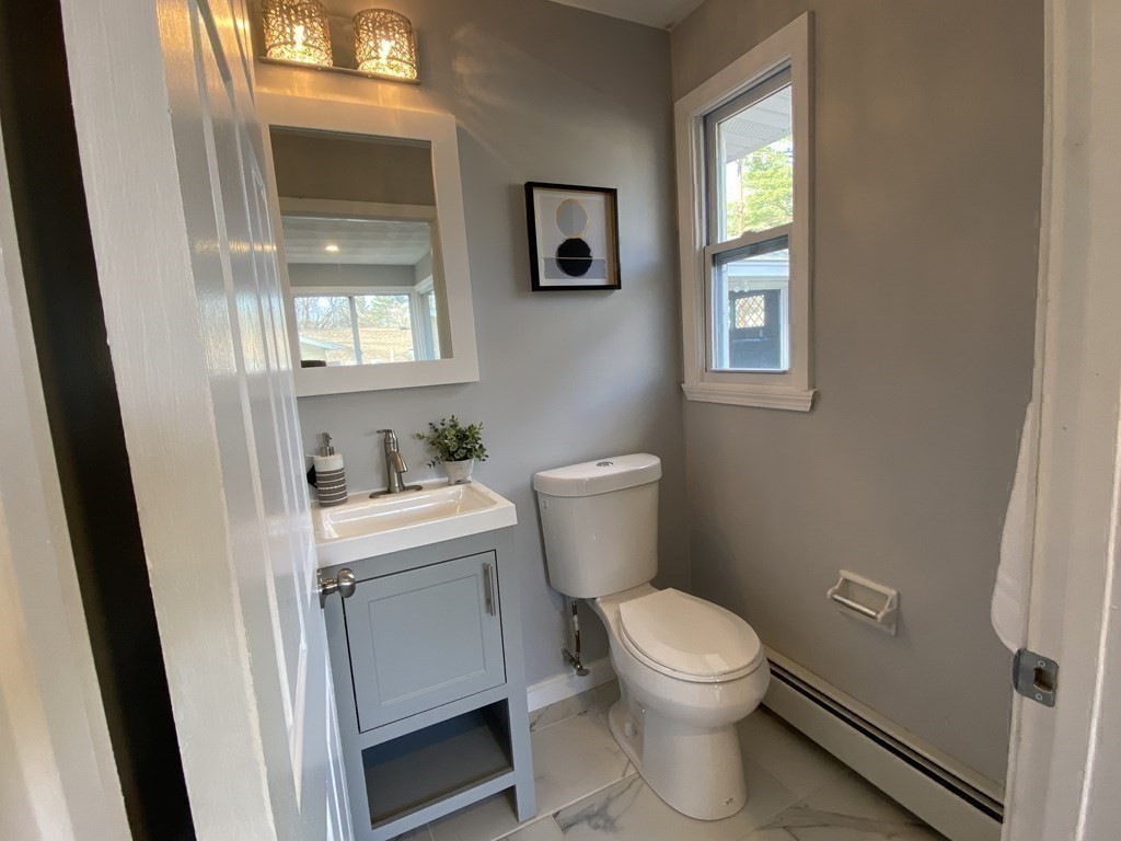 82 Griffin Road Framingham, MA 01701 - Photo 28 of 39 a bathroom with a sink a toilet and a window