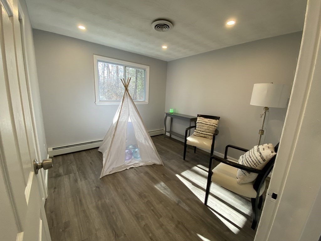 82 Griffin Road Framingham, MA 01701 - Photo 31 of 39 a living room with furniture and a wooden floor