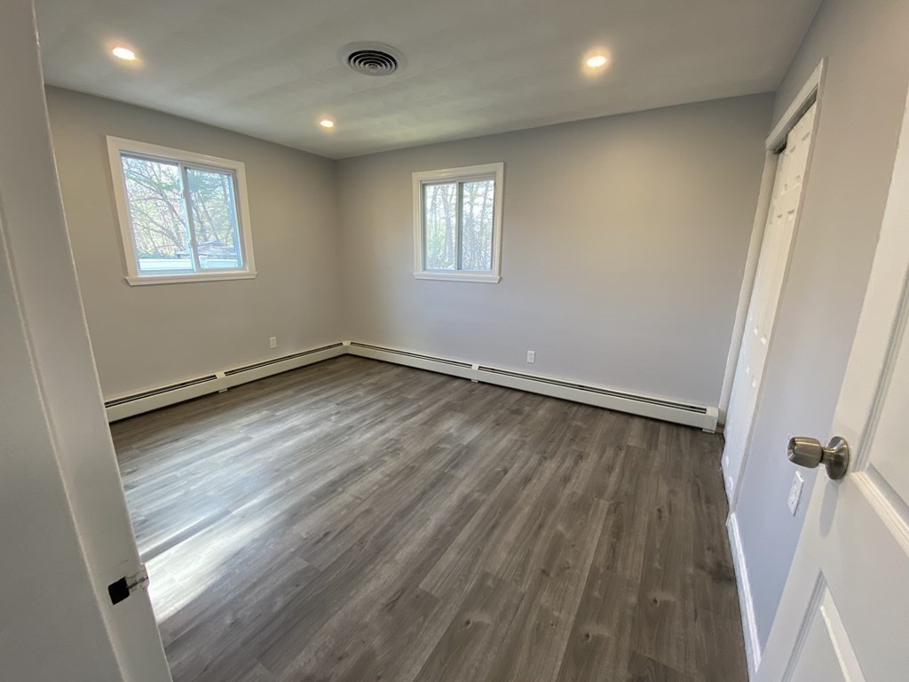 82 Griffin Road Framingham, MA 01701 - Photo 32 of 39 wooden floor in an empty room with a window