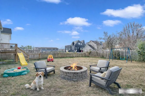 a view of a terrace with furniture and a fire pit