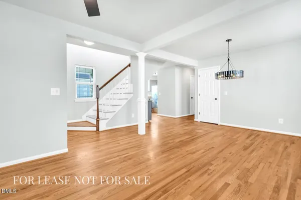 a view of an entryway with wooden floor