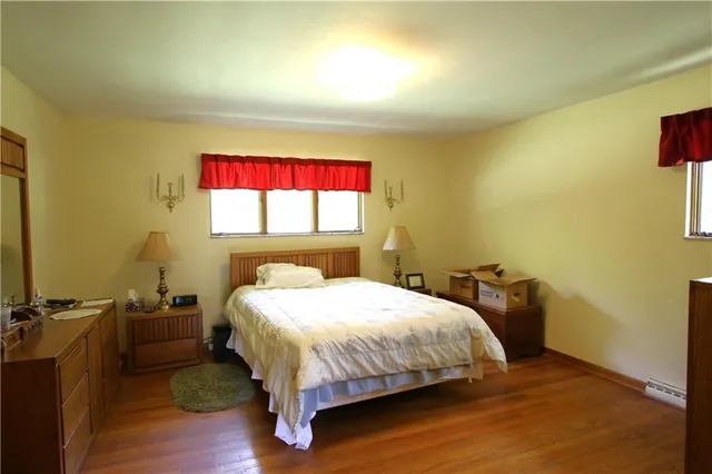 a bedroom with a bed and window