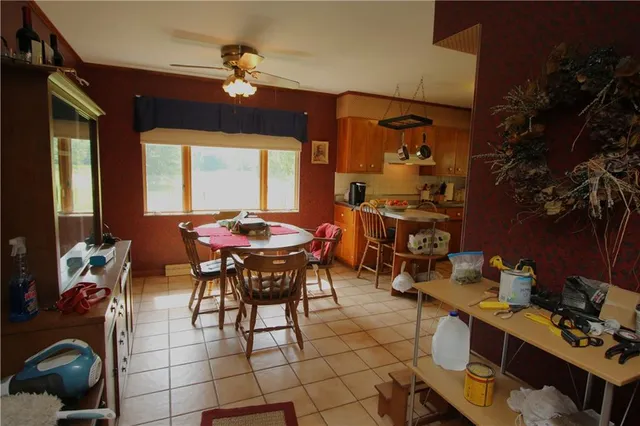 a view of a dining room with furniture and chandelier