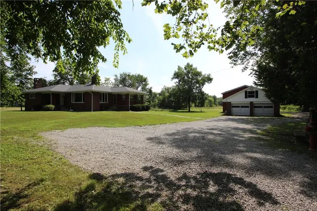 a view of residential houses with outdoor space