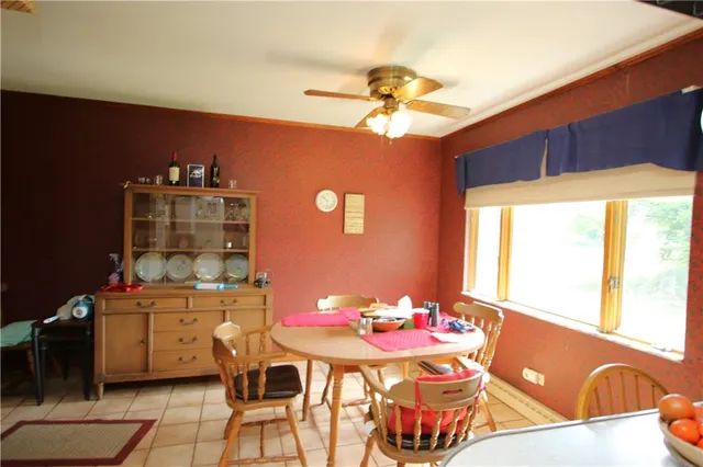 a dining room with a table and chairs