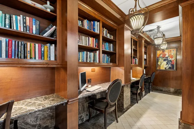 a view of a workspace with furniture