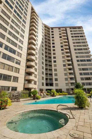 a view of a building with a swimming pool