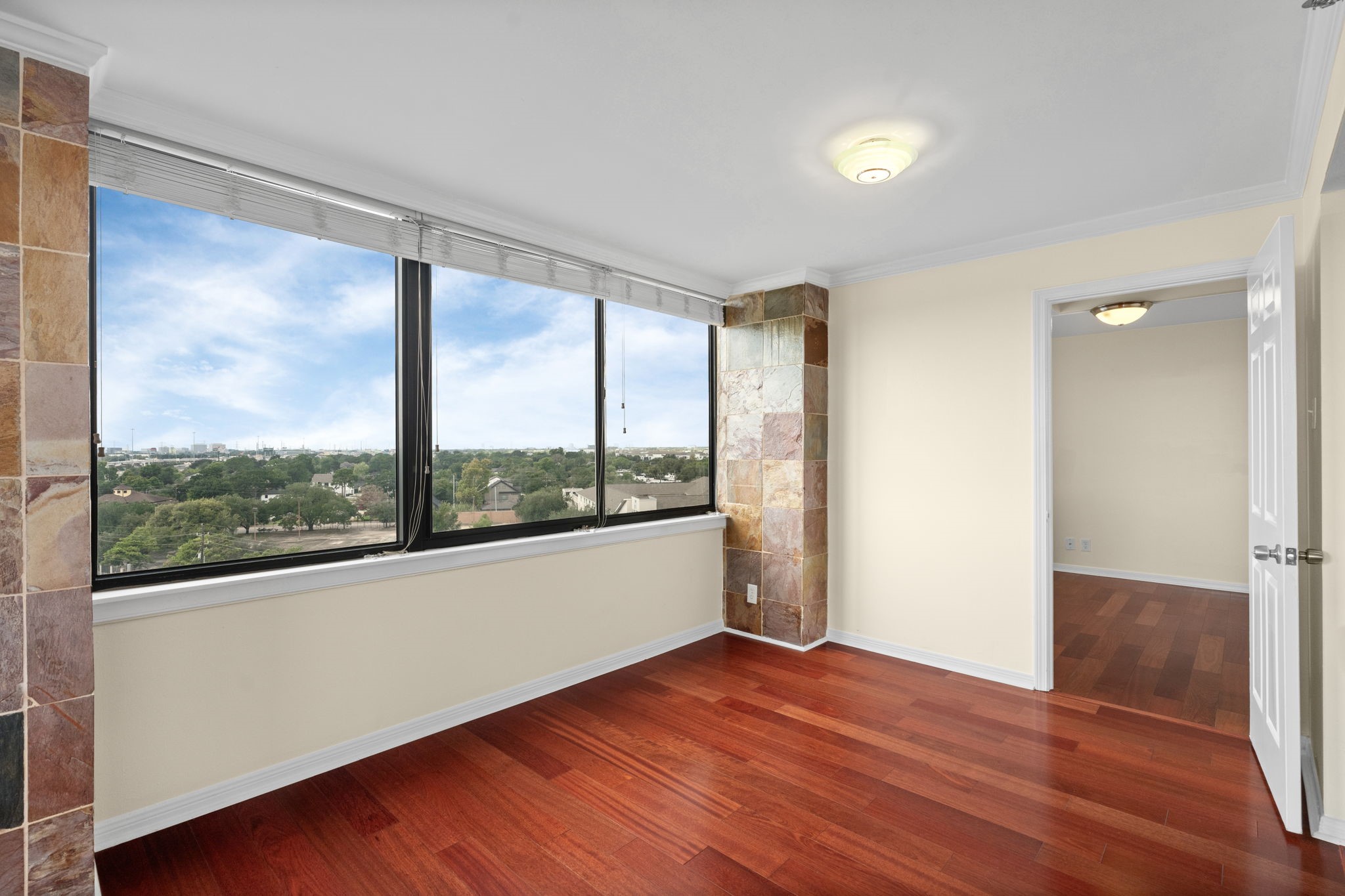 3525 Sage Road, Unit 903 Houston, TX 77056 - Photo 5 of 26 a view of a room with wooden floor and doors