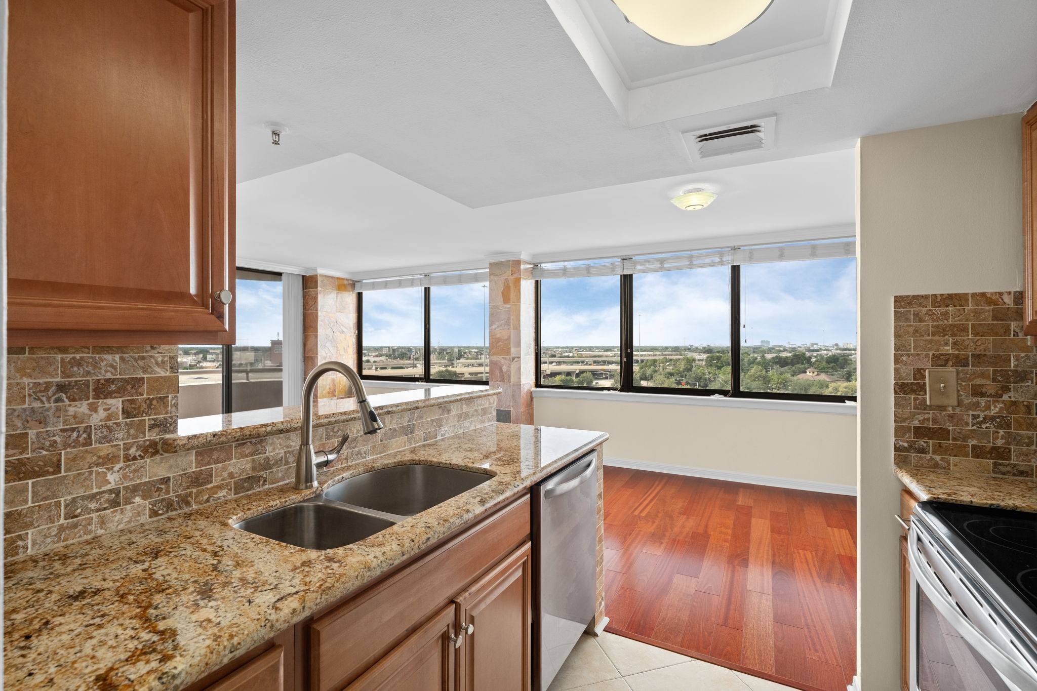 3525 Sage Road, Unit 903 Houston, TX 77056 - Photo 7 of 26 a kitchen with a sink and a large window